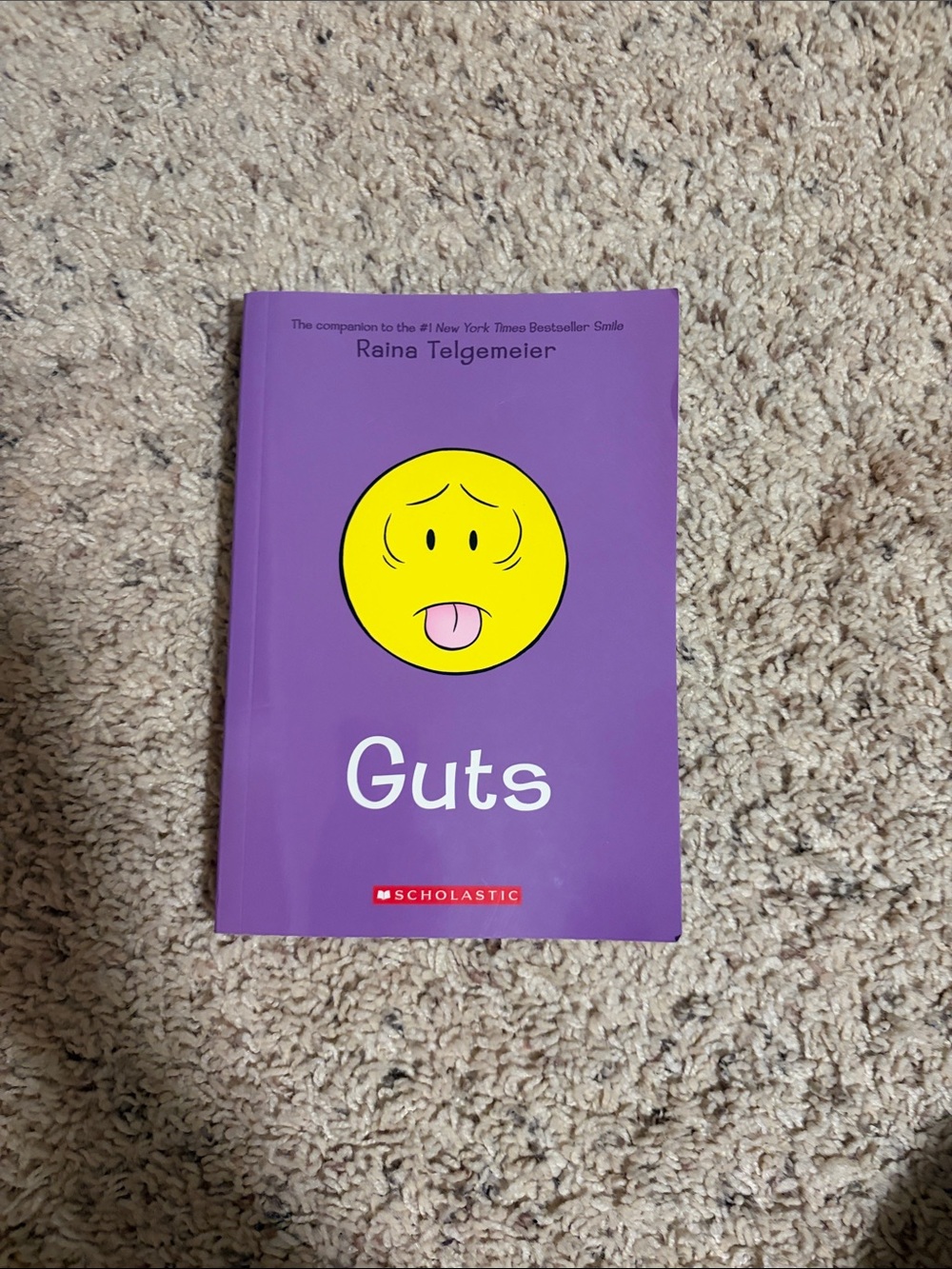 Scholastic Guts - Purple Cover with Yellow Emoticon